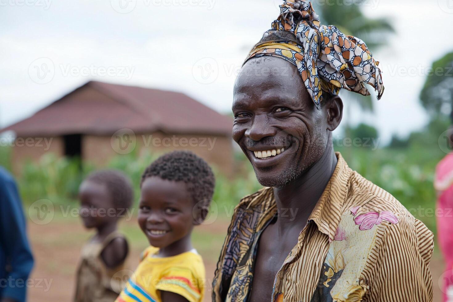 A smiling man with children in the background photo