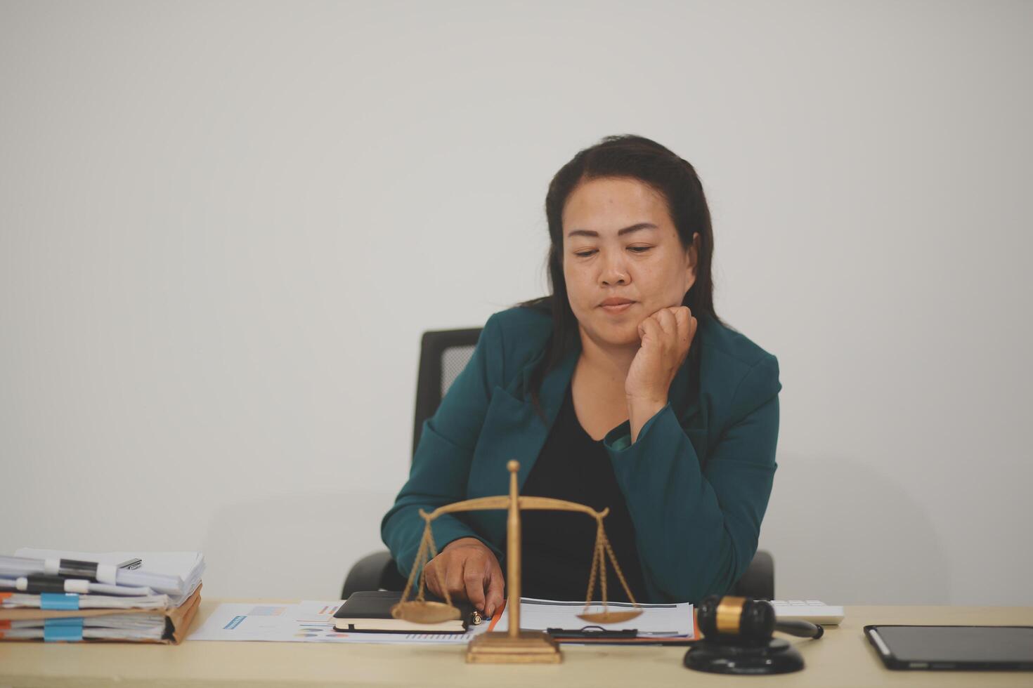 Pretty Asian female lawyer working and hammer, laptop, justice advice and legal concept. In office photo