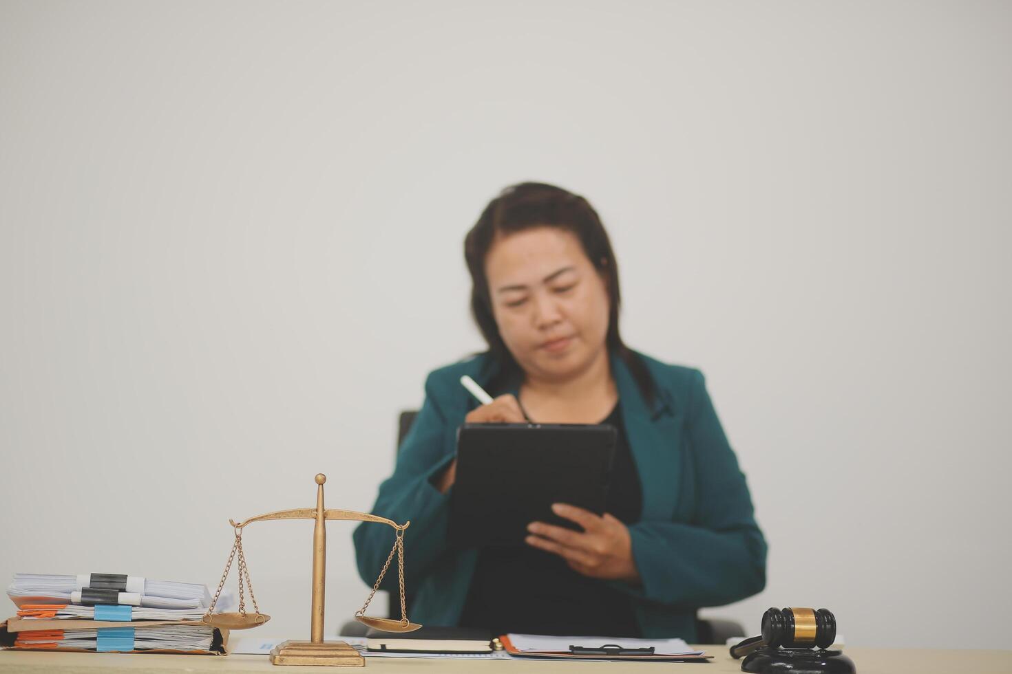 Pretty Asian female lawyer working and hammer, laptop, justice advice and legal concept. In office photo
