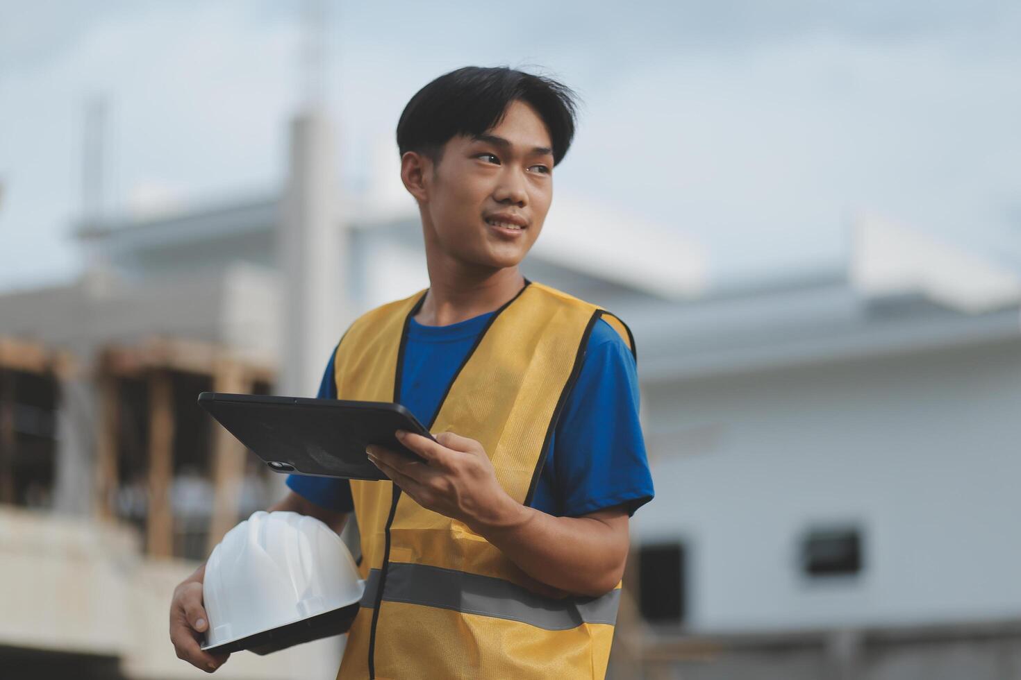worker inspection while in Left hand hold tablet. inspector engineer using tablet. photo
