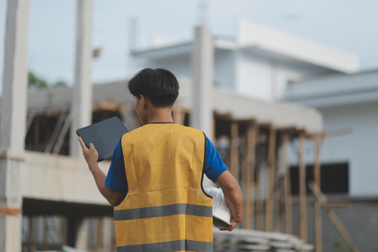 worker inspection while in Left hand hold tablet. inspector engineer using tablet. photo