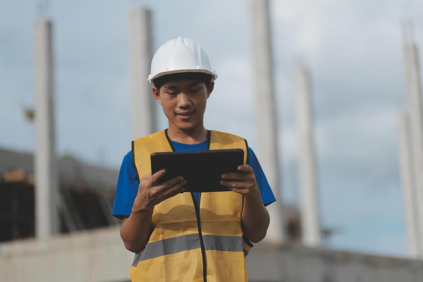 worker inspection while in Left hand hold tablet. inspector engineer using tablet. photo