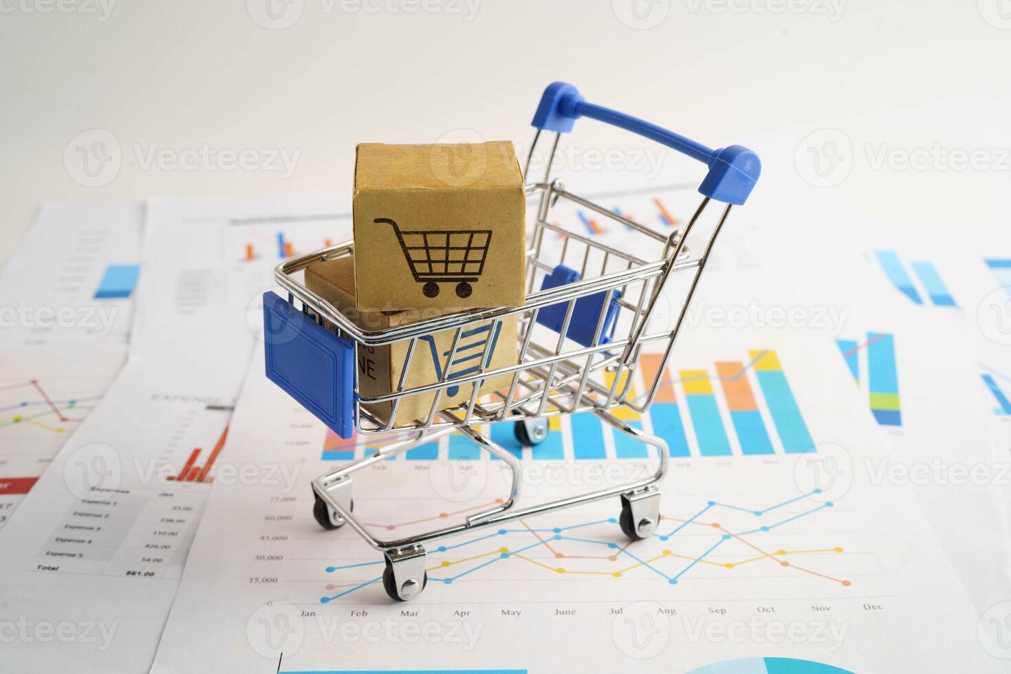 Online shopping, Shopping cart box on business graph, import export, finance commerce. photo