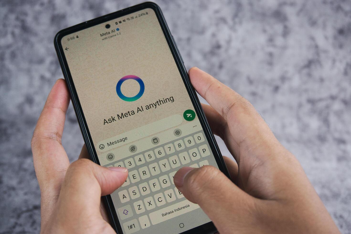 Smartphone Displaying Meta AI Chat Application With User Typing on the Keyboard photo