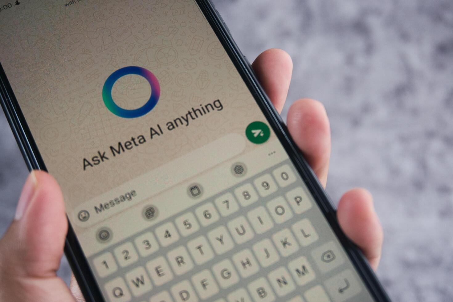 Smartphone Displaying Meta AI Chat Application With User Typing on the Keyboard photo