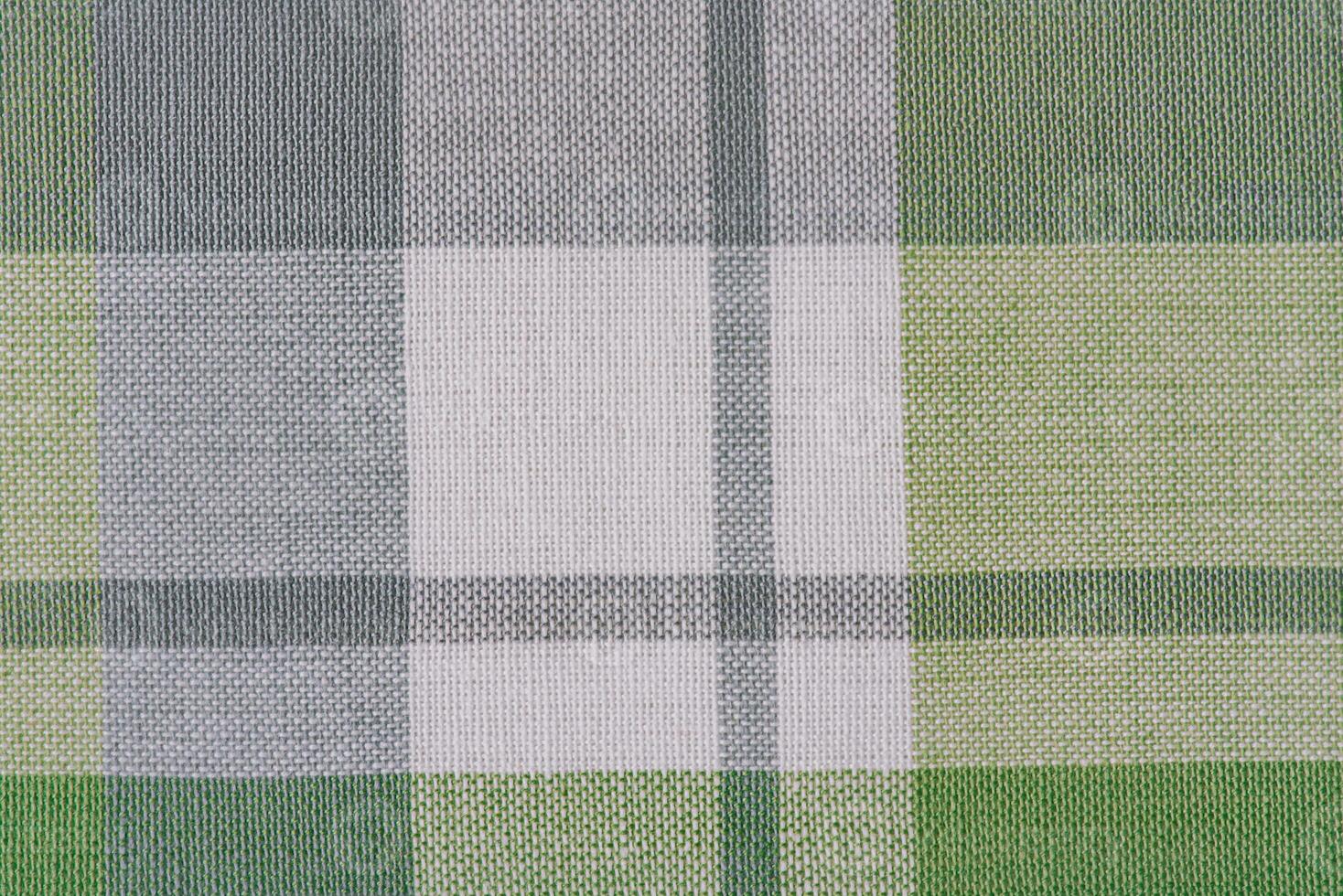 Green and white checkered fabric as a background. photo