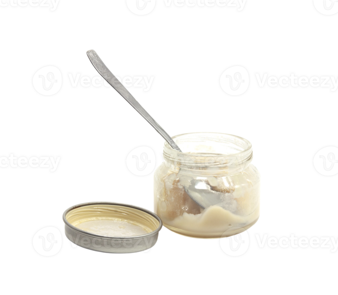 A jar of cream and spoon png