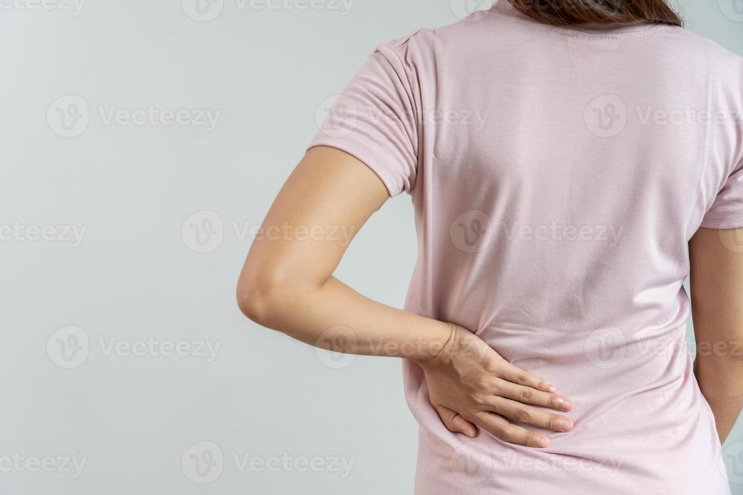 lower back while and suffer from unbearable pain health and problems, chronic back pain, backache in office syndrome, scoliosis, herniated disc, muscle inflammation photo