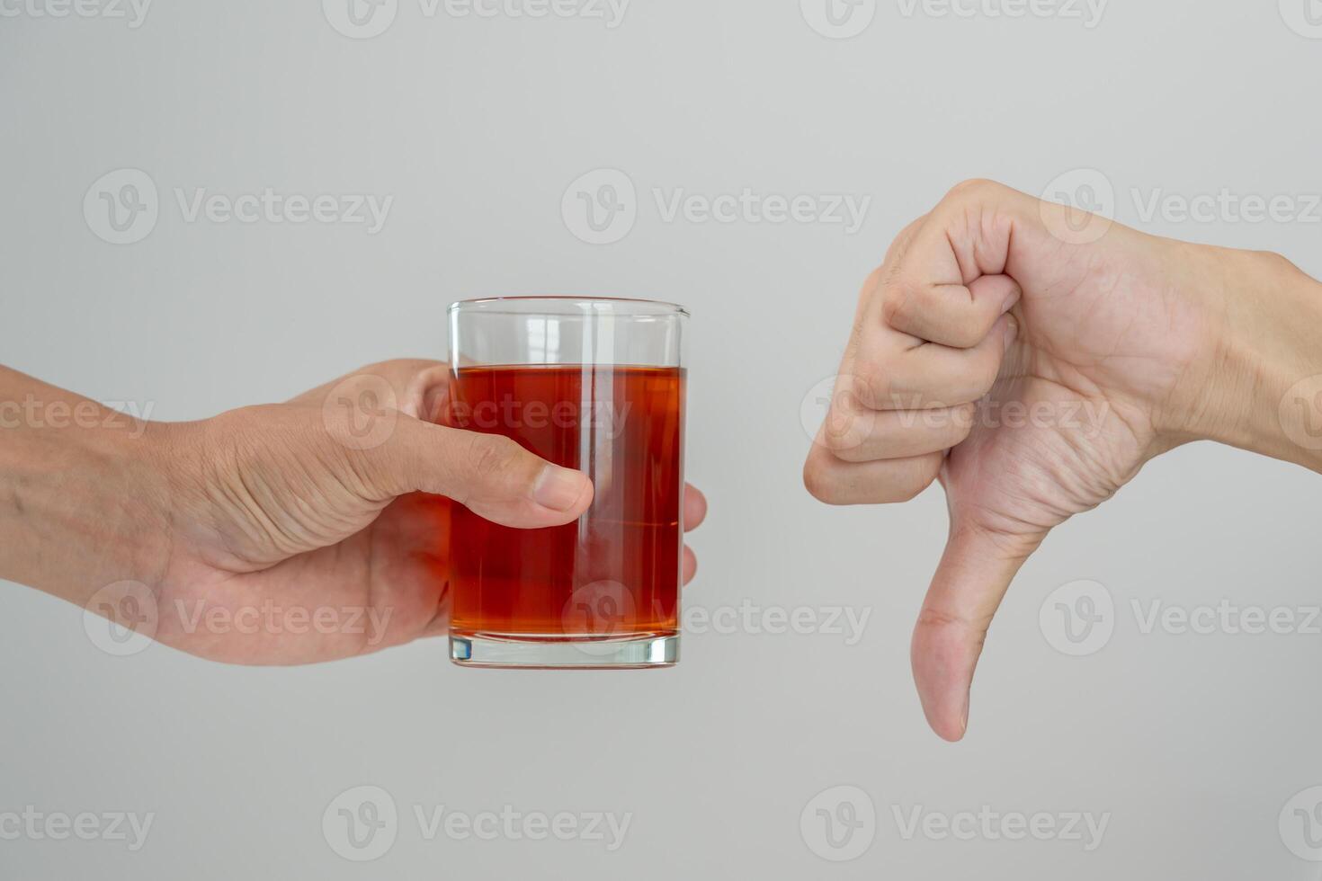 man refuses say no and avoid to drink an alcohol whiskey, stopping hand sign male, alcoholism treatment, alcohol addiction, quit booze, Stop Drinking Alcohol. Refuse Glass liquor, unhealthy, reject photo