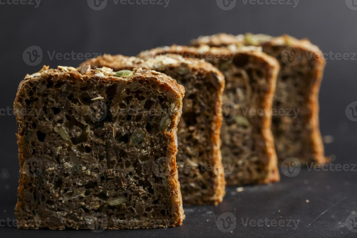 Freshly baked slices of nutritious whole grain bread lined up photo