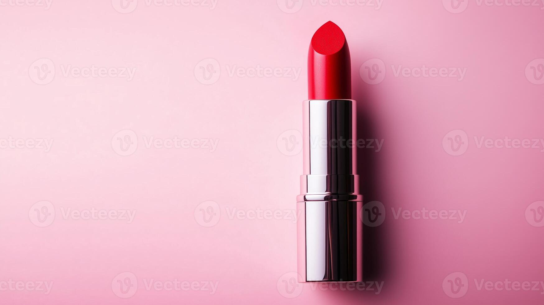 A Close Up of Vibrant Red Lipstick on Pink Surface photo