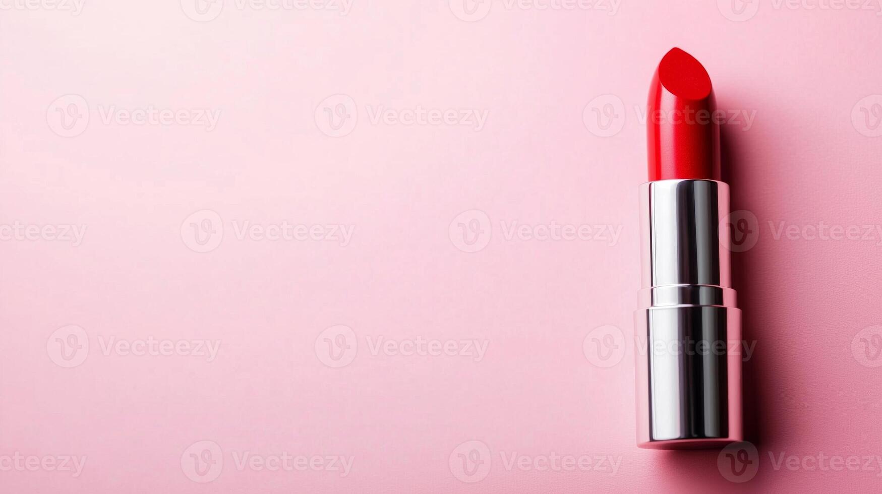 A Striking Red Lipstick on a Soft Pink Background photo