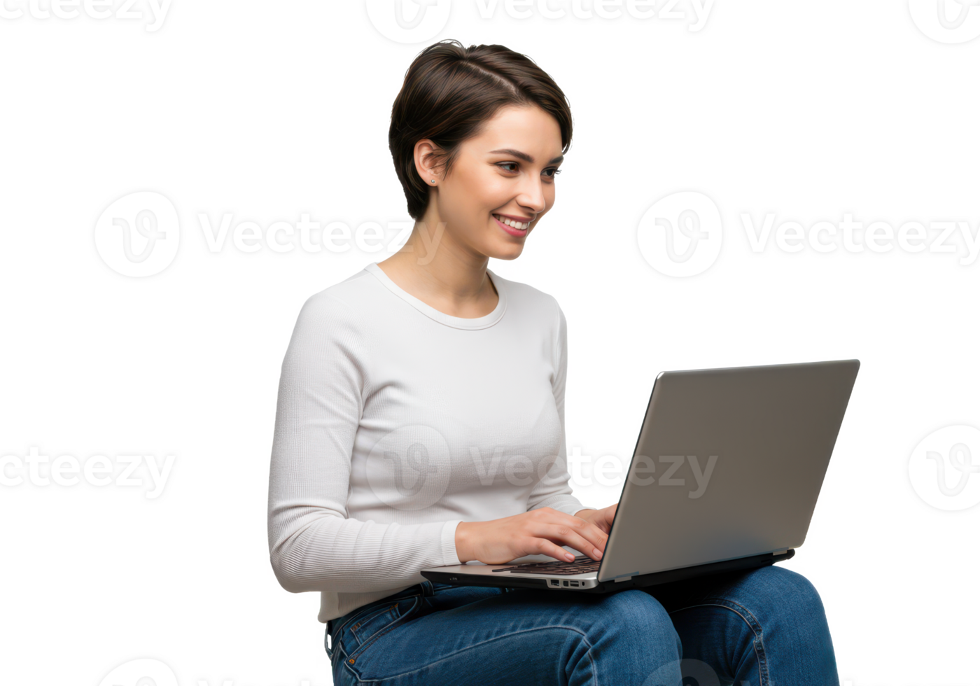 A young woman with short brown hair, wearing a white shirt and jeans, sitting while working on a laptop isolated on transparent background png