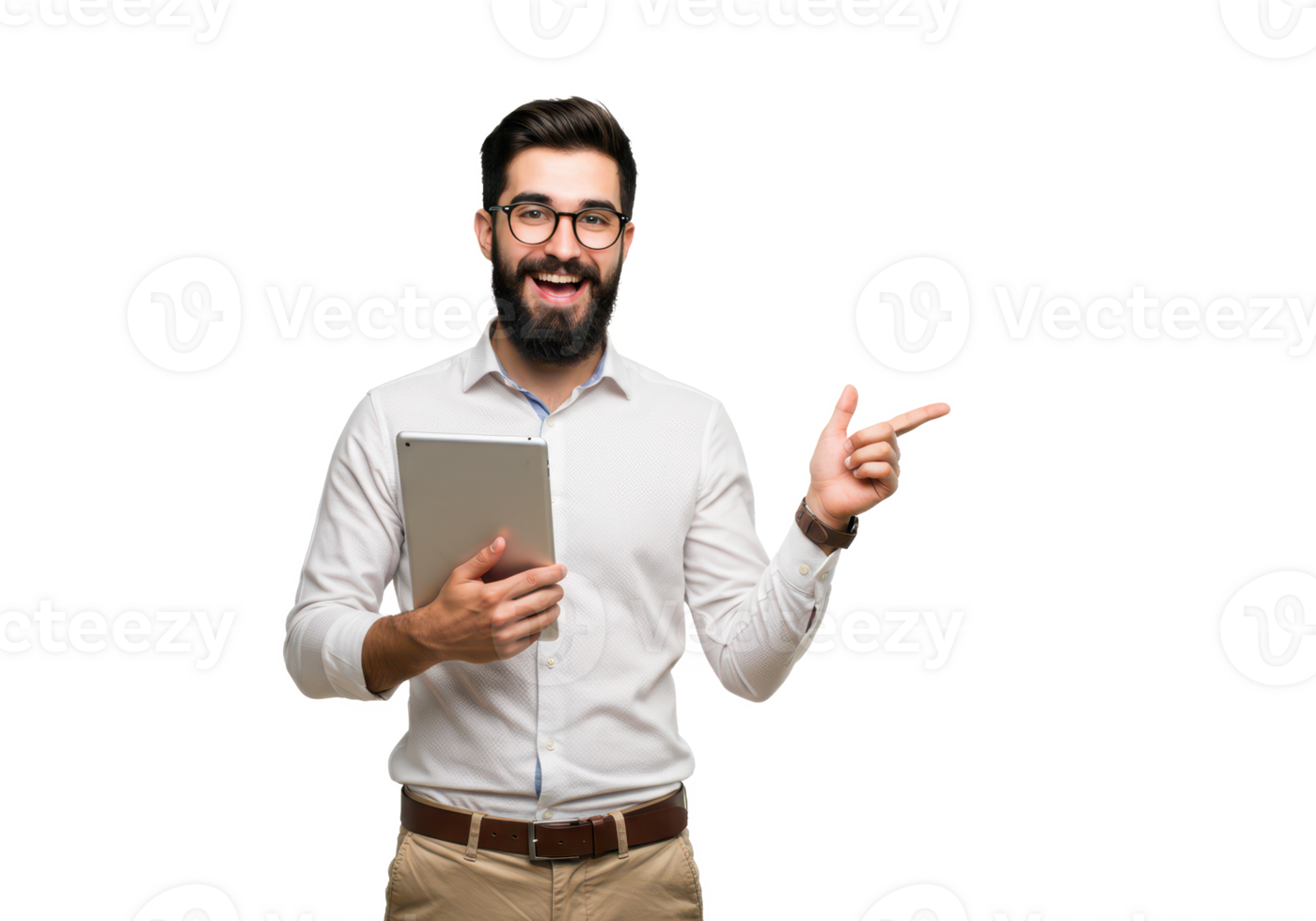 A cheerful young man with a beard, wearing glasses, a white shirt, and beige trousers, holding a tablet in one hand and pointing to the side isolated on transparent background png
