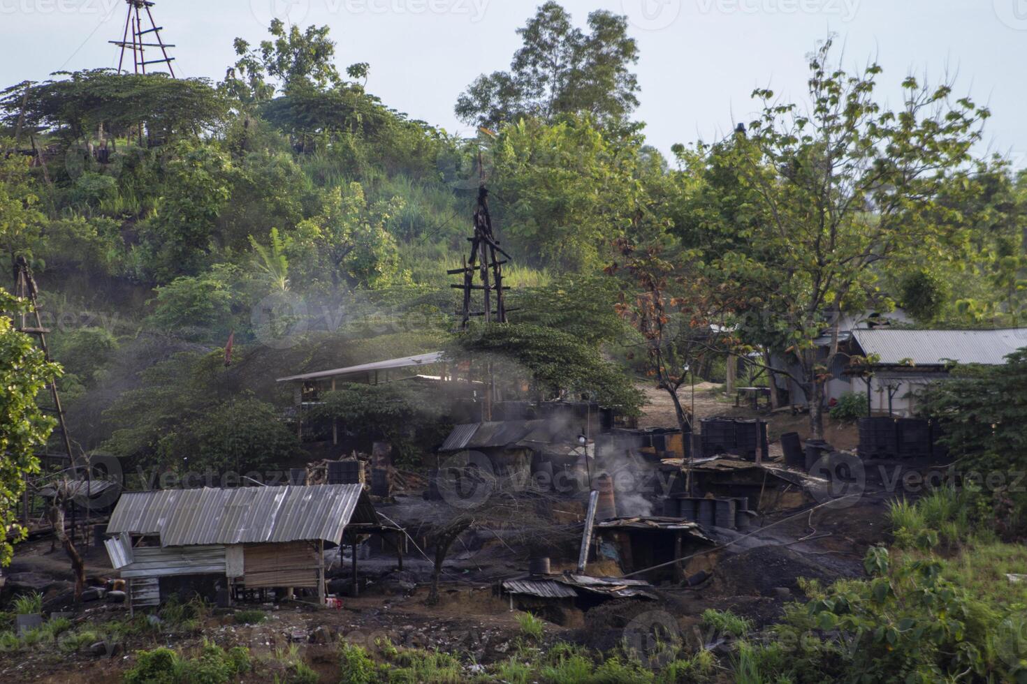 Teksas Wonocolo mining, a petroleum geoheritage located in Bojonegoro, East Java, Indonesia. This place offers views of old oil mining wells managed by the community in a traditional way. photo