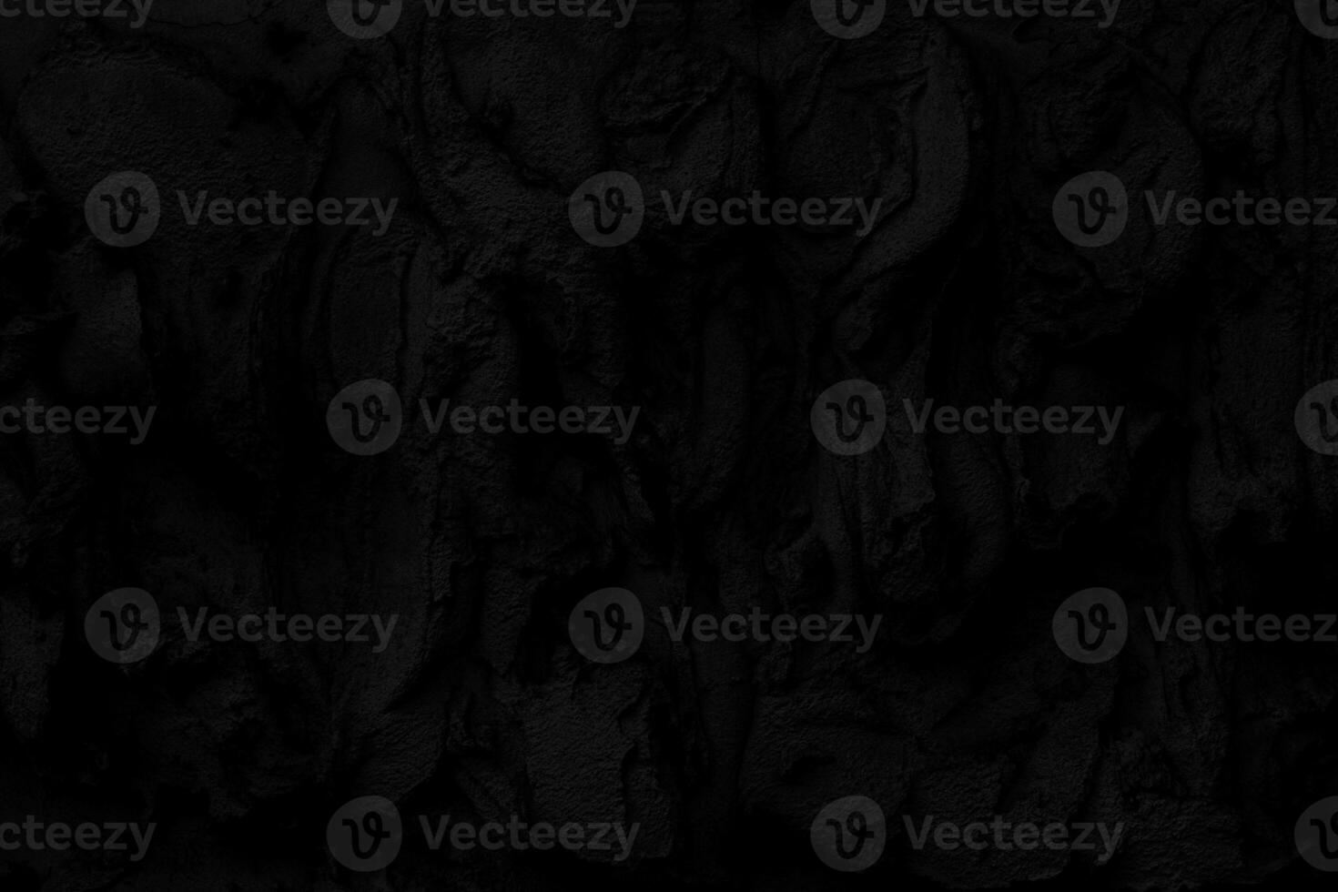 Abstract black background. Black stucco texture. Dark rough surface. Architectural stucco molding made of cement. photo