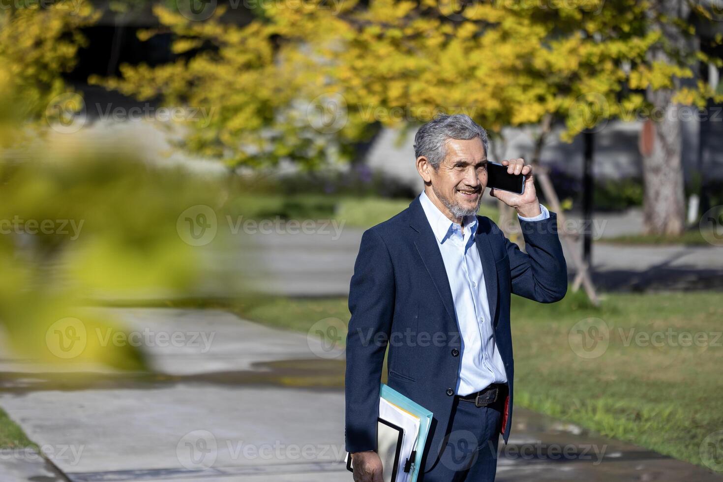 Senior executive managing director is answering call from shareholders for global business expansion and professional marketing strategy in stock market investment during autumn photo