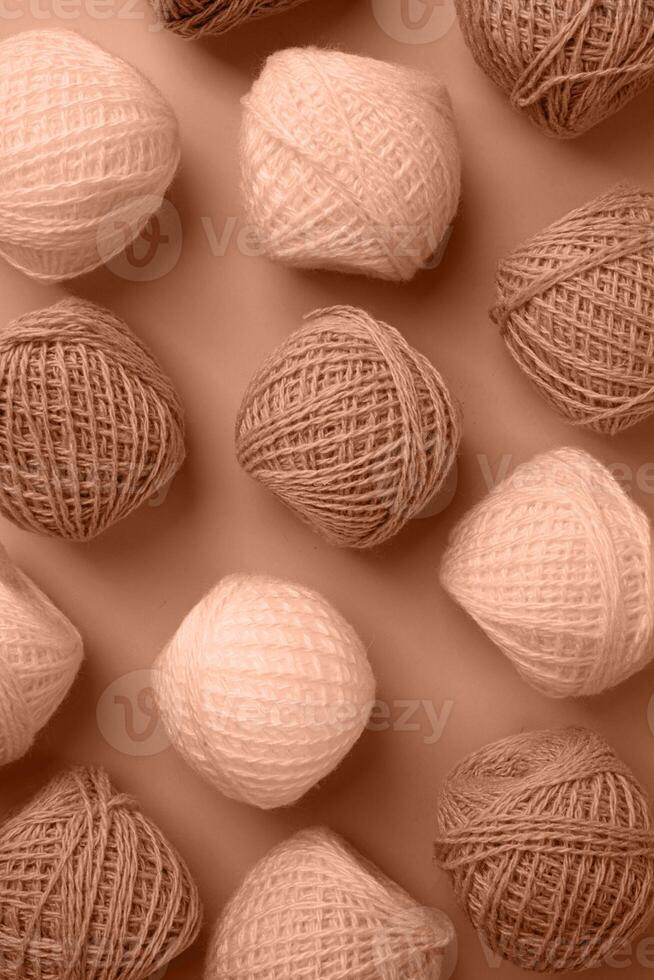 Mocha Mousse - color of the year 2025. yarn wool on brown backdrop, top view flat lay photo