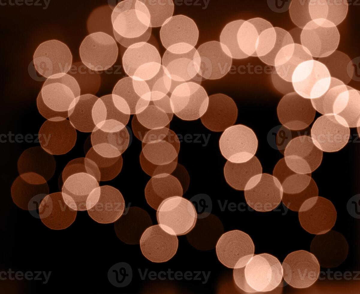 Mocha Mousse - color of the year 2025. Christmas lights in bokeh. photo