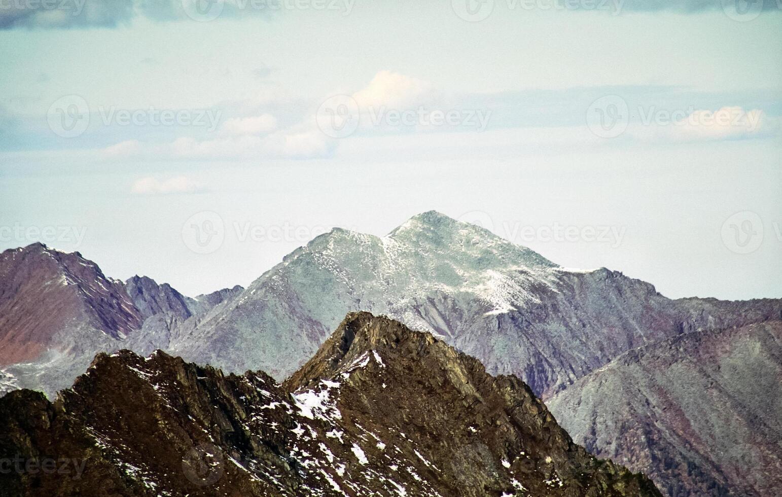 Mount Sayan in winter in snow. The nature of the mountains is sayan. photo