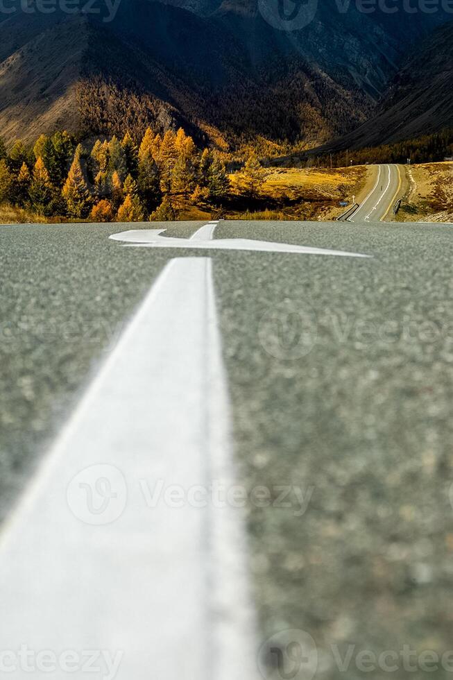 Asphalt road to the mountains. Mountain track on Altai. photo
