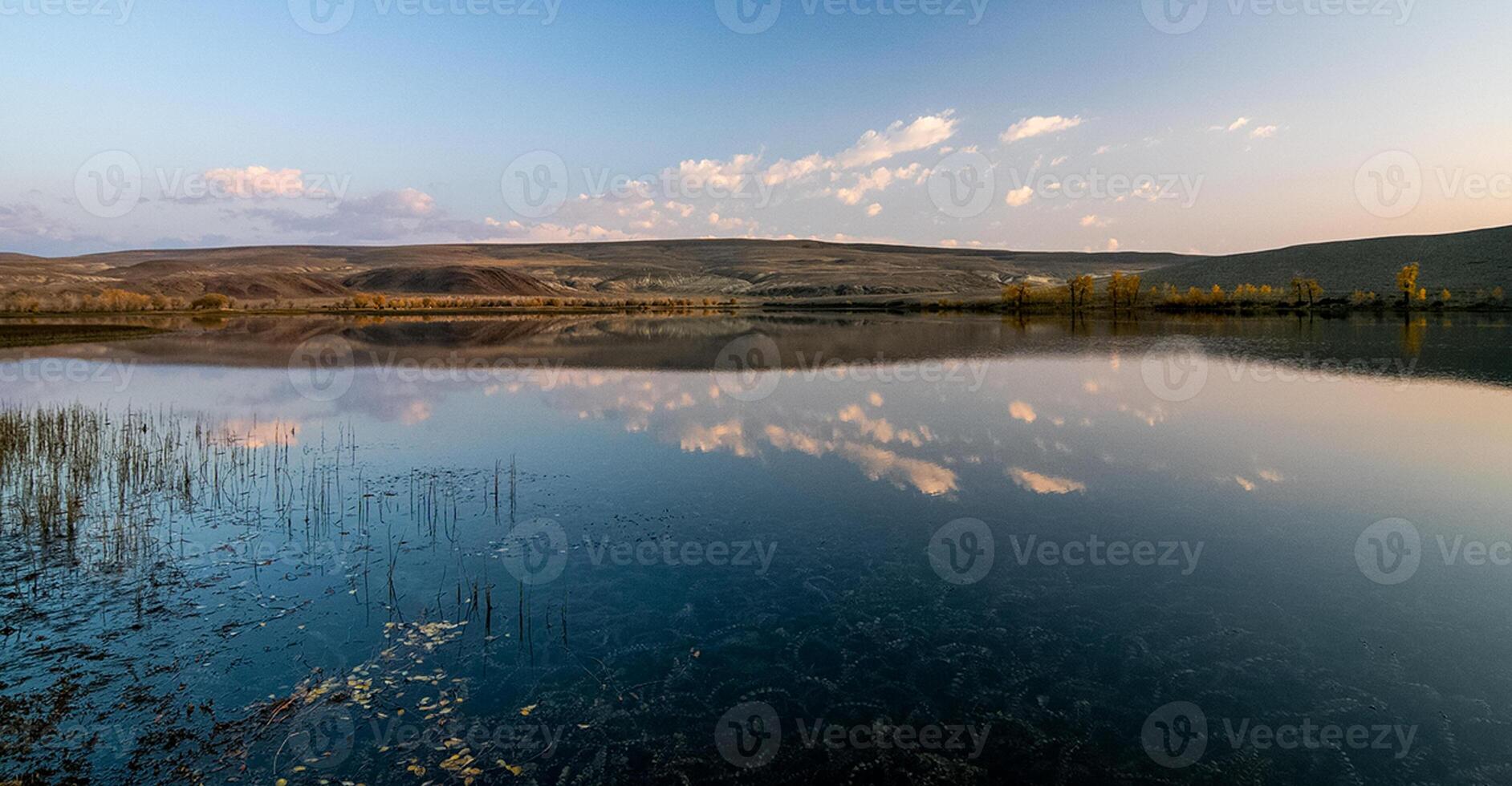Lake in Altai Mountains. Panorama of the Altai landscape in the mountains. The time of year is autumn. photo