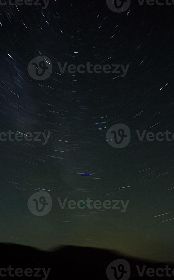Starry sky over the mountains. view of the night sky in autumn. photo
