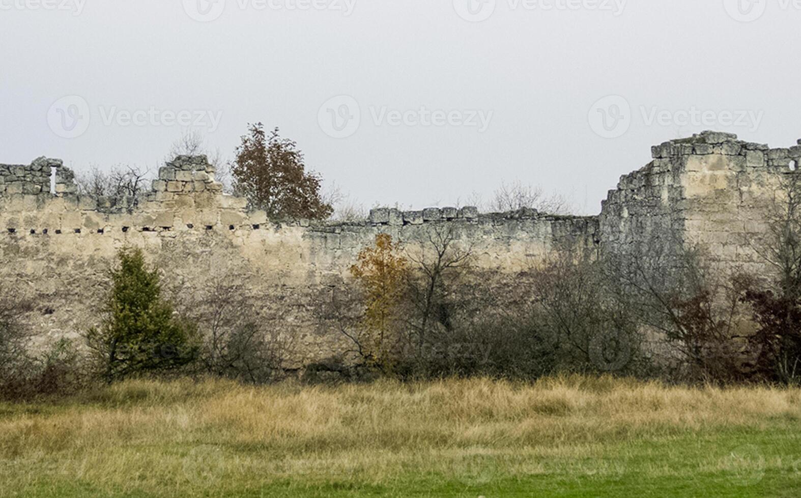 old limestone house on a cliff on the edge of a cliff. photo