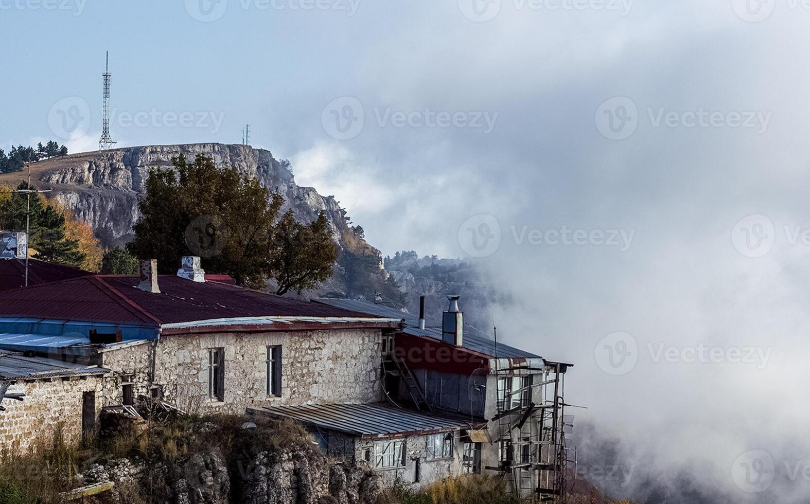 At home near the rocks. Stone houses in mountain village. Crimea photo