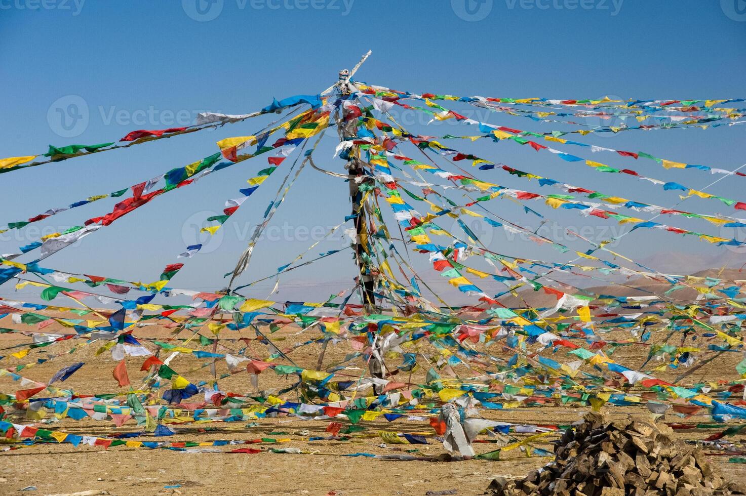Colored rags on rope in Tibet. Rituals and beliefs. photo