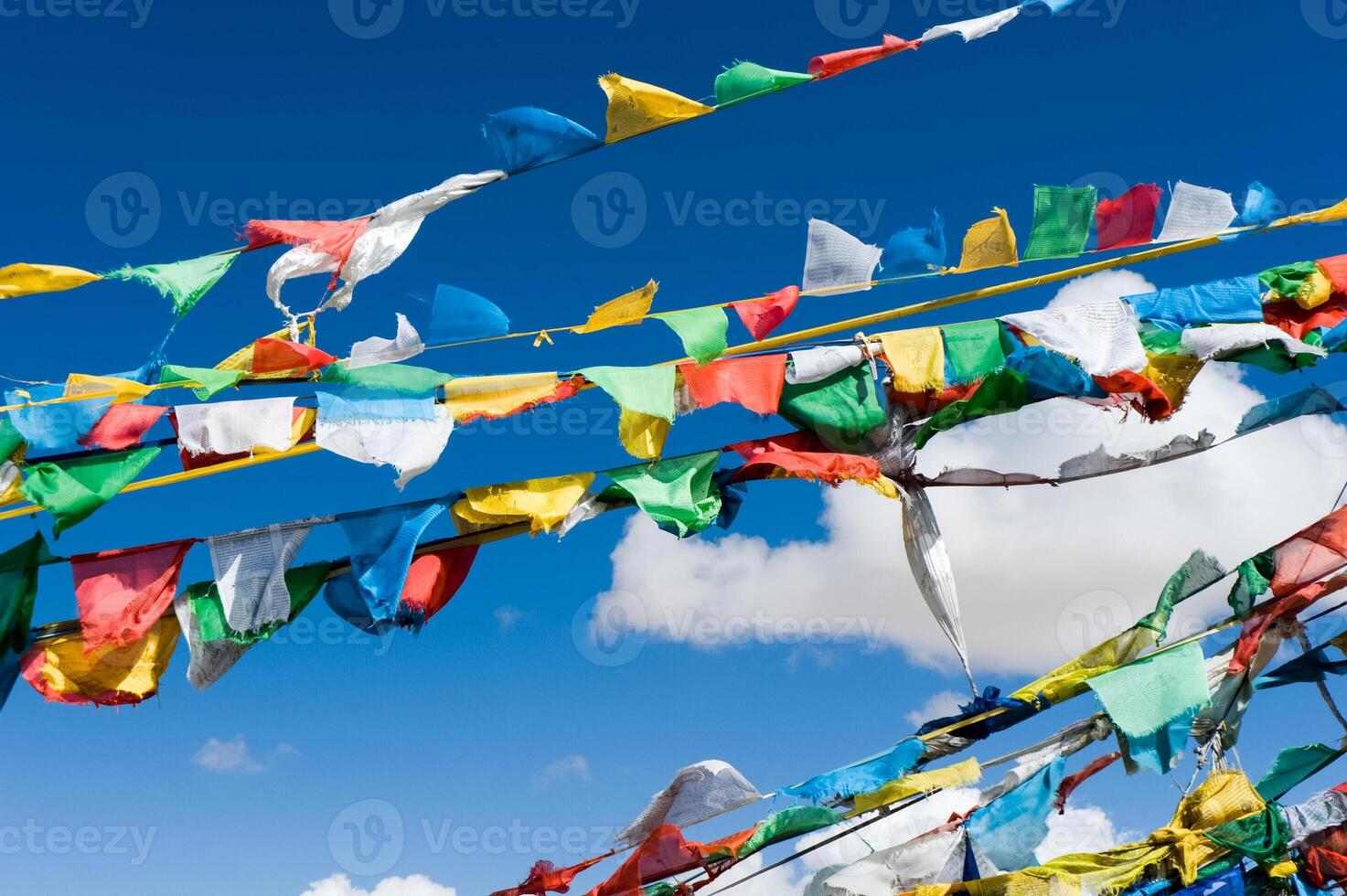Colored rags on rope in Tibet. Rituals and beliefs. photo