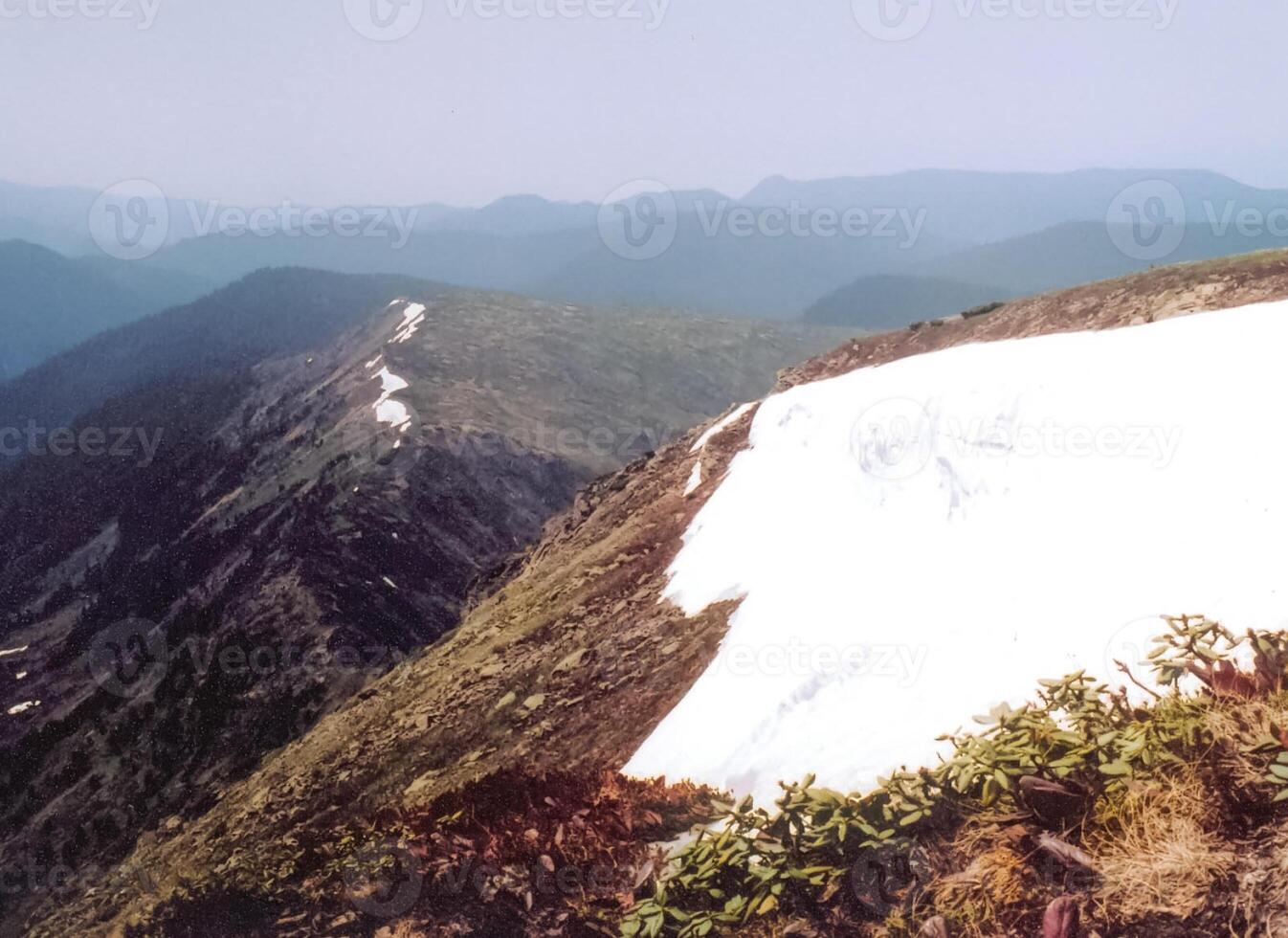 Mount Sayan in winter in snow. The nature of the mountains is sayan. photo