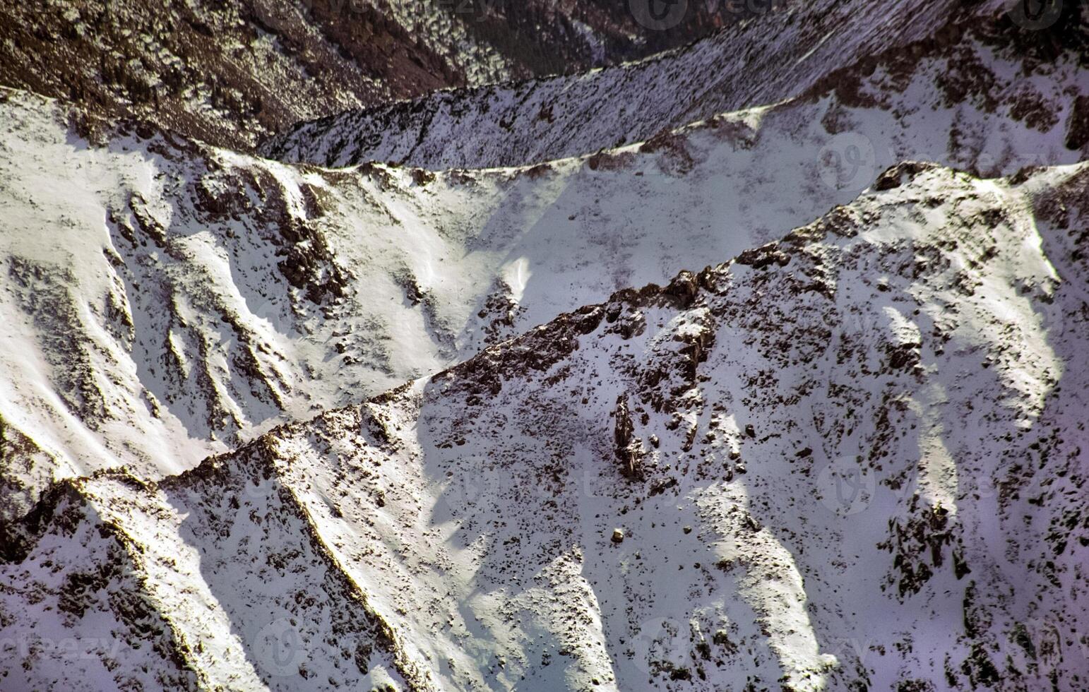 Mount Sayan in winter in snow. The nature of the mountains is sayan. photo