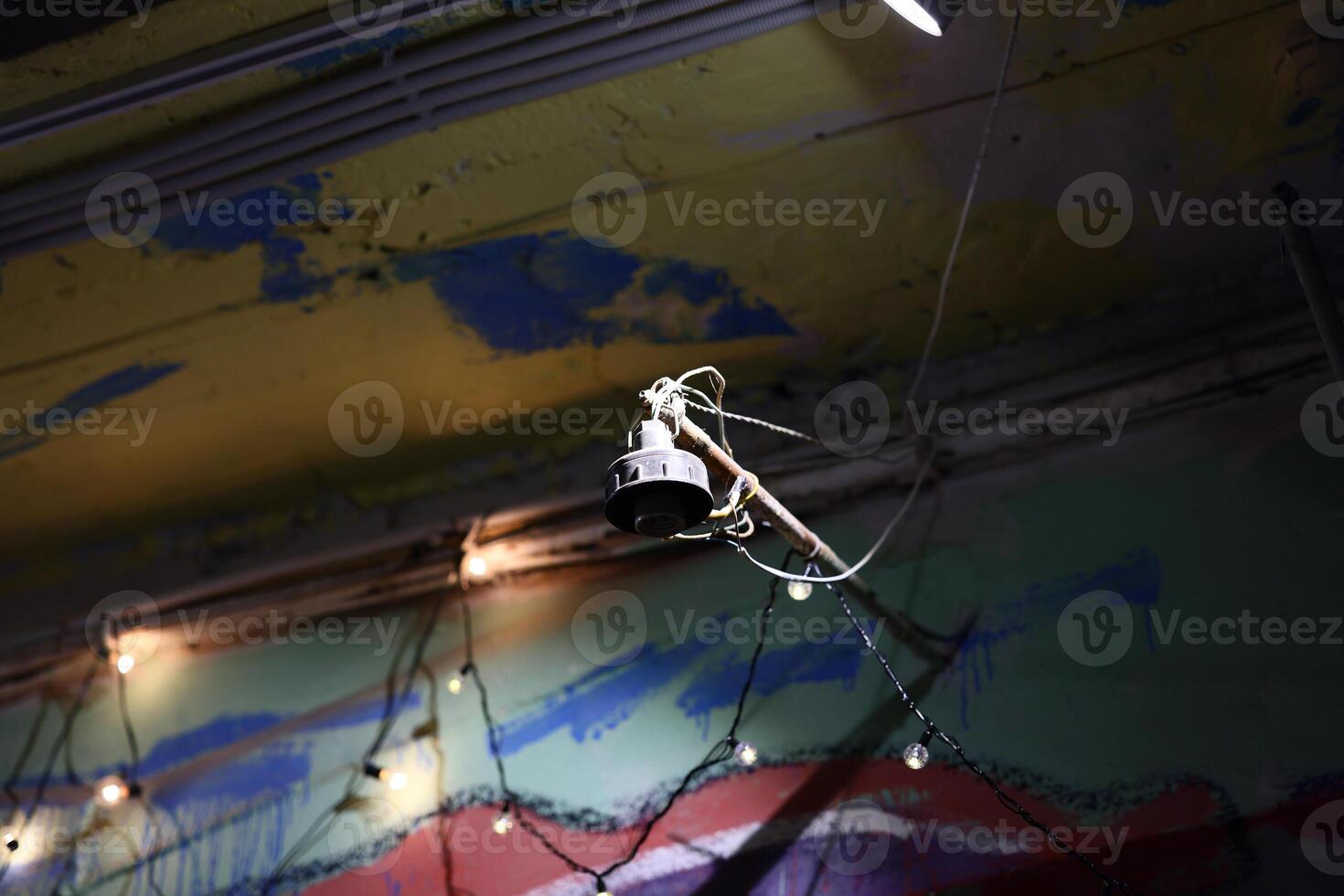 Experience Unique Industrial Lighting combined with Artistic Wall Background for your space photo