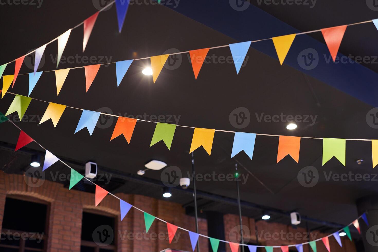 Vibrant and Colorful Bunting Flags Decoration Perfect for Enhancing Indoor Space Atmosphere photo