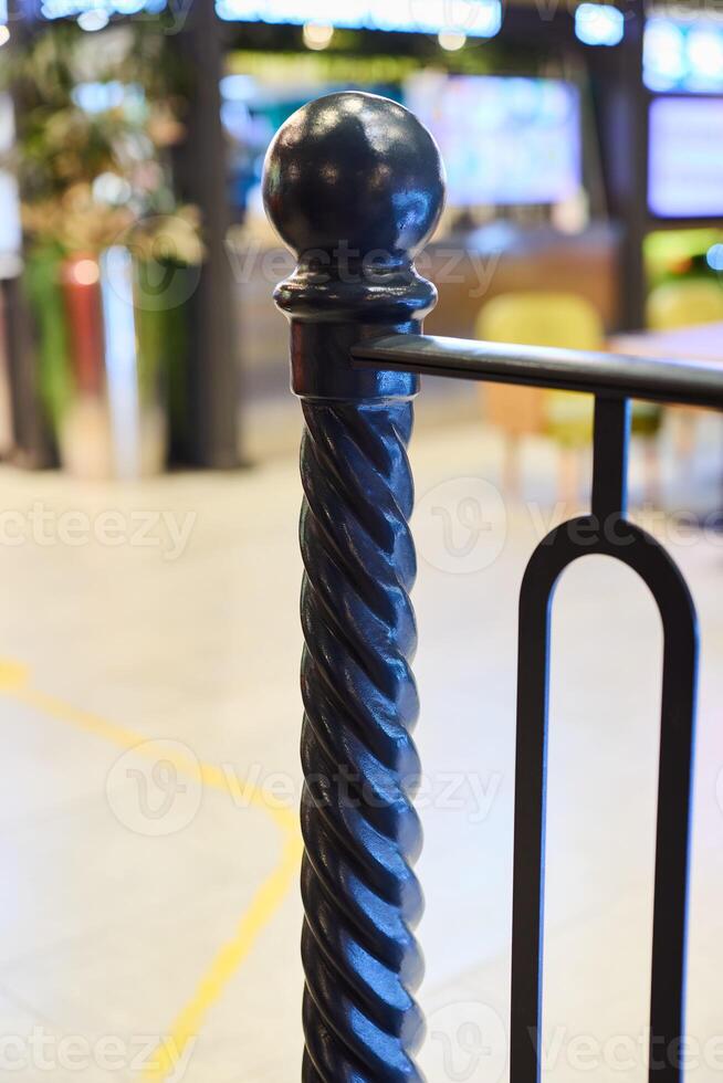 The Elegant Black Twisted Railing Post Amidst a Chic and Modern Interior Setting photo
