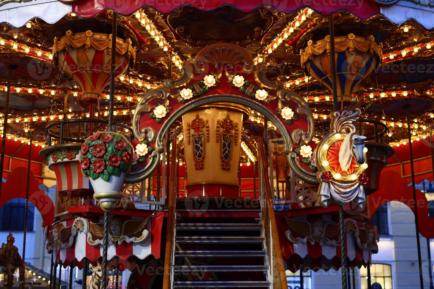 Experience the enchanting and charming carousel adorned with vibrant lights and beautiful decor photo