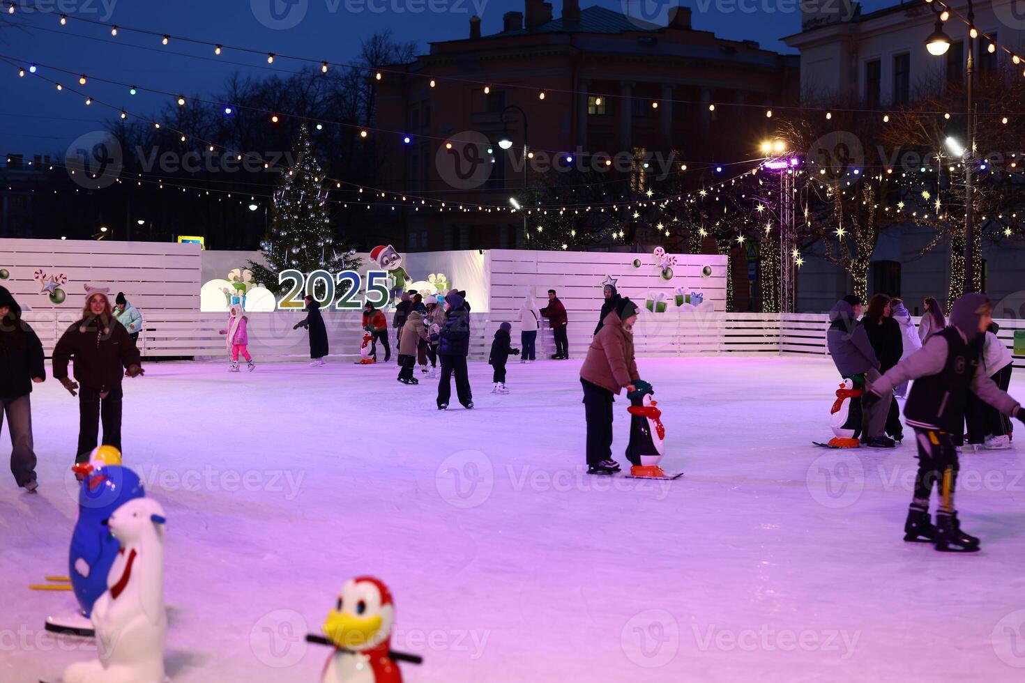 Enjoy a Magical Ice Skating Evening Surrounded by Festive Decor and a Joyful Atmosphere photo