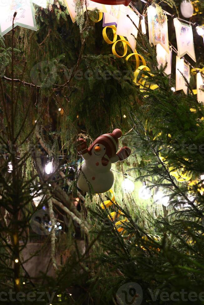 Delightful Christmas Tree Decoration with a charming Snowman Ornament for holiday cheer photo