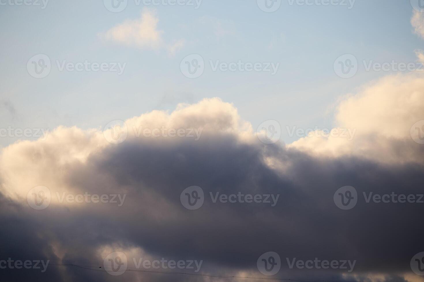 A Dramatic Sky Featuring Beautiful Fluffy Clouds with an Idyllic and Serene Atmosphere photo