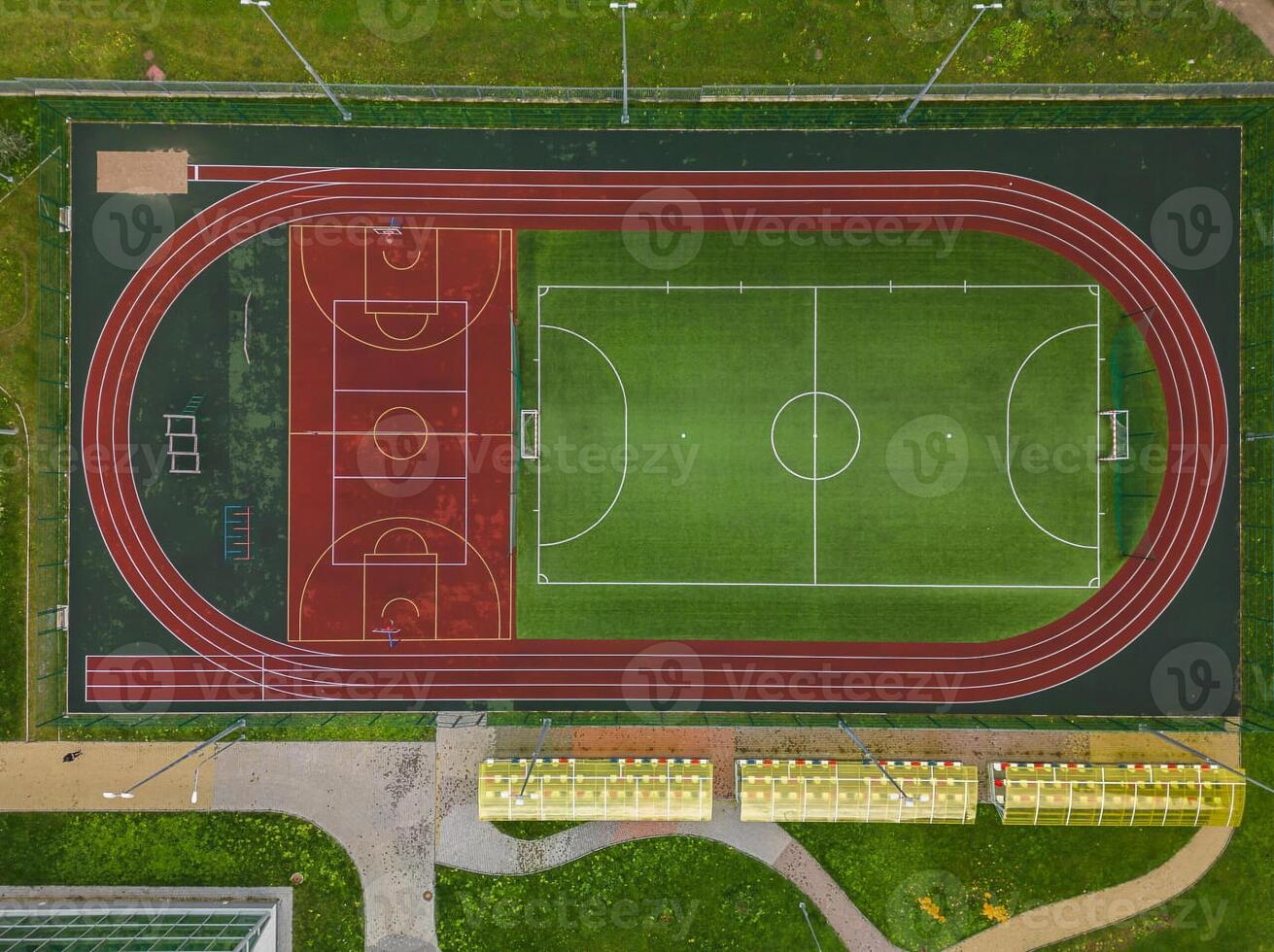 Aerial View of a MultiSport Field Featuring a Track Area and Soccer Pitch for Activities photo