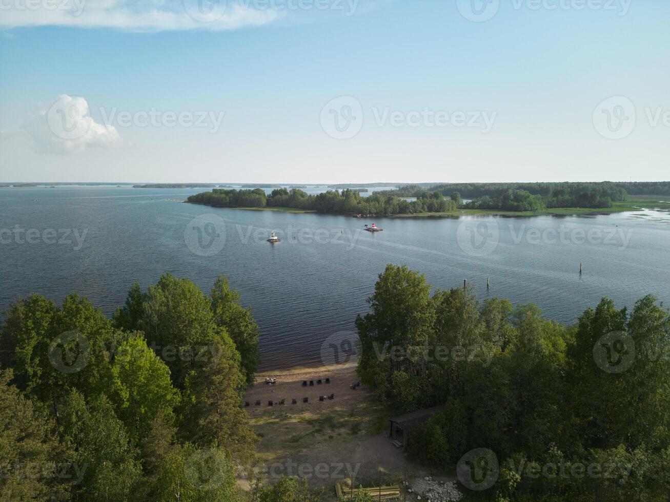 A Serene Lakeside View Featuring Lush Greenery Surrounded by Scenic Natural Beauty photo