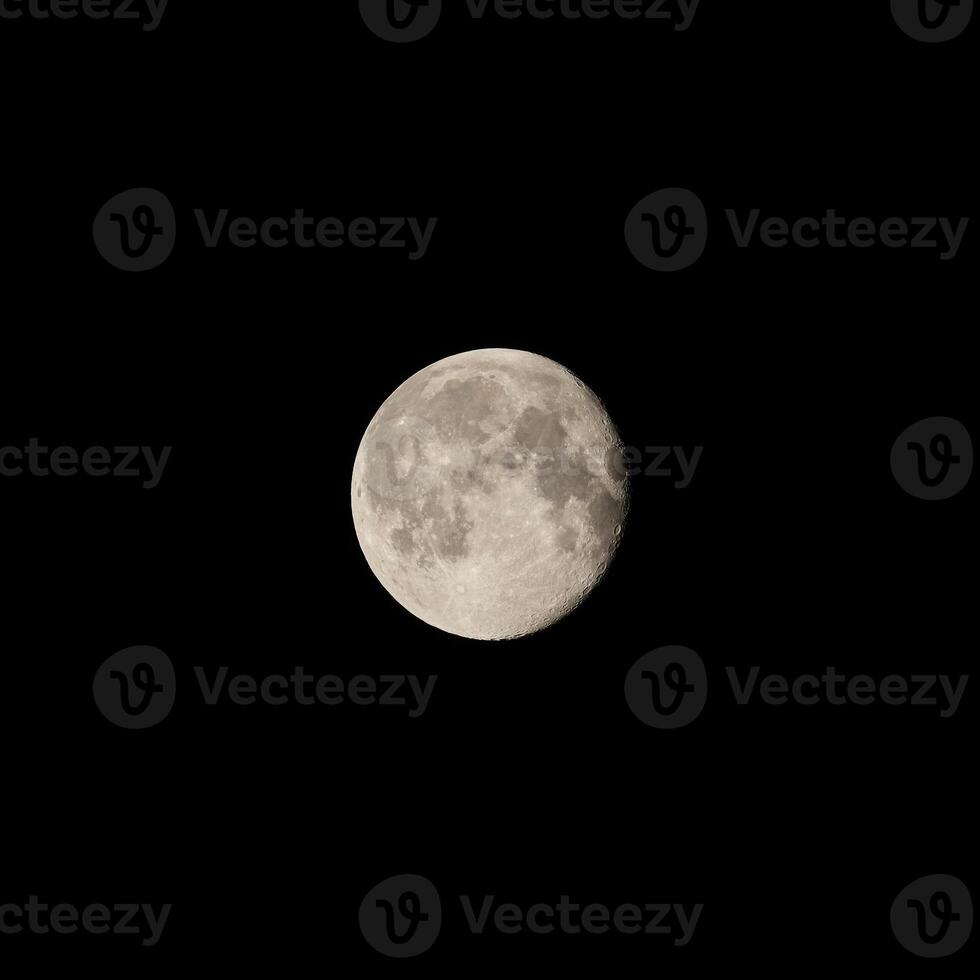 A breathtaking and stunning full moon gracefully illuminates the dark night sky above photo