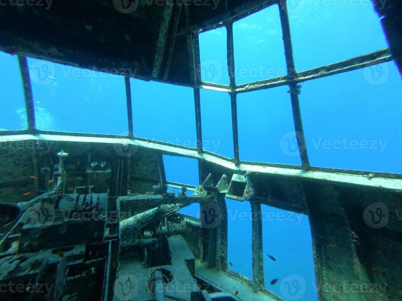 A stunning and enchanting underwater view showcasing a shipwreck cockpit full of secrets photo