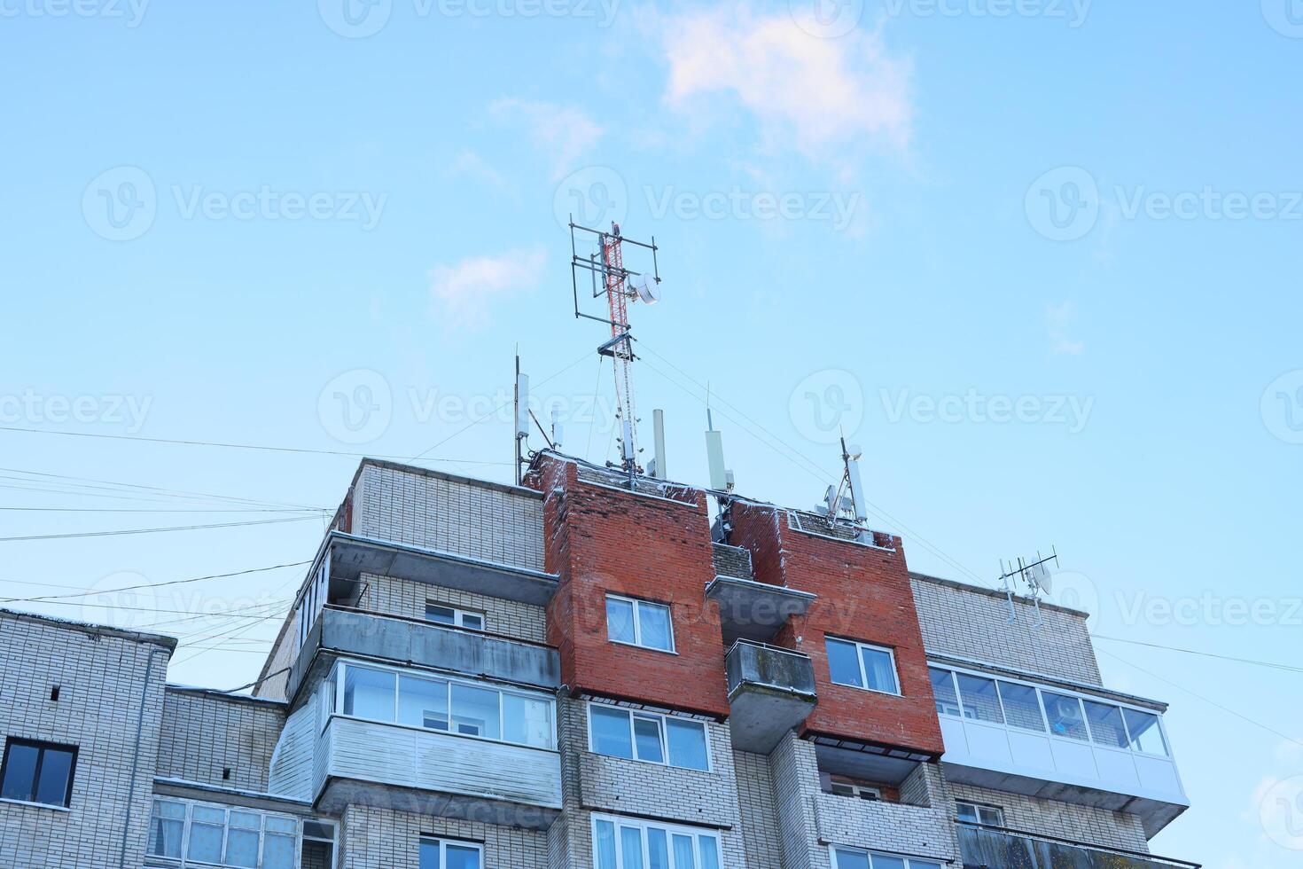 Telecommunication Equipment Installed on the Rooftop of an Apartment Building in the City photo