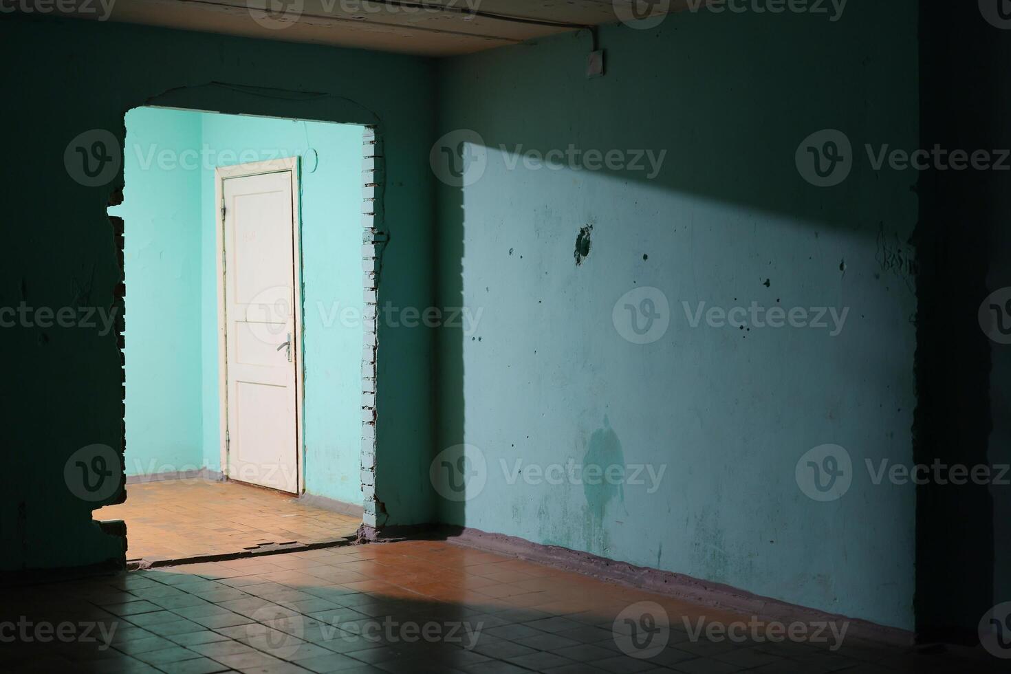 A mysterious doorway is set within a soft blue room, which is bathed in gentle light and serenity photo