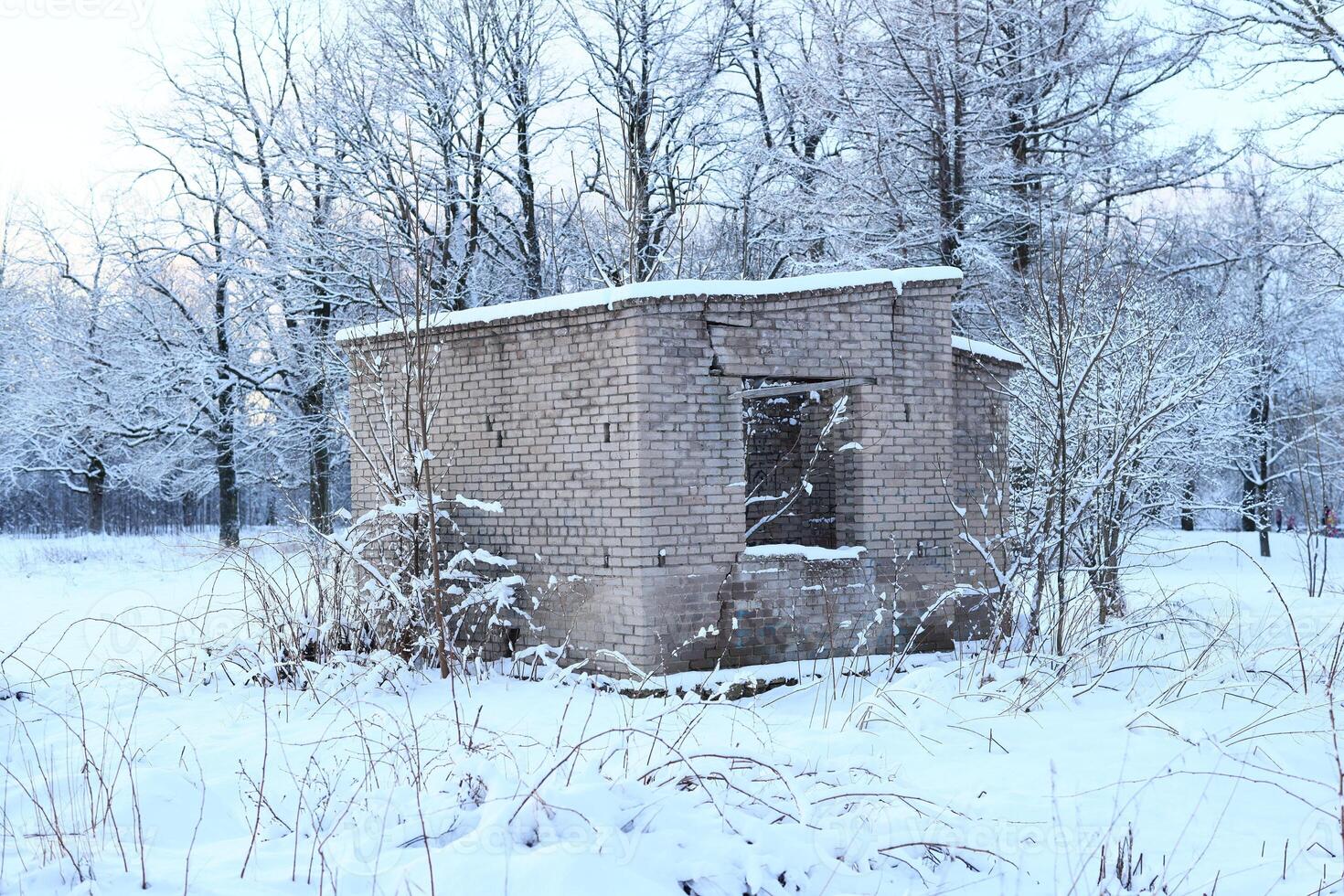 An Abandoned Structure Set Against a Beautiful Winter Landscape, Evoking a Deep Sense of Nostalgia photo