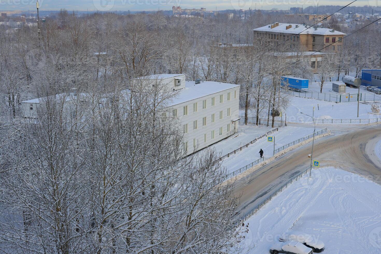 A Beautiful Snowy Winter Landscape Featuring Striking Modern Architecture Elements photo