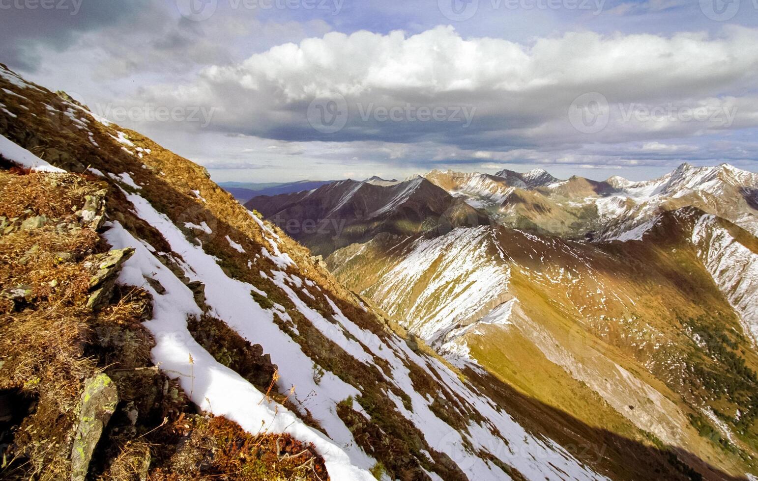 Mount Sayan in winter in snow. The nature of the mountains is sayan. photo