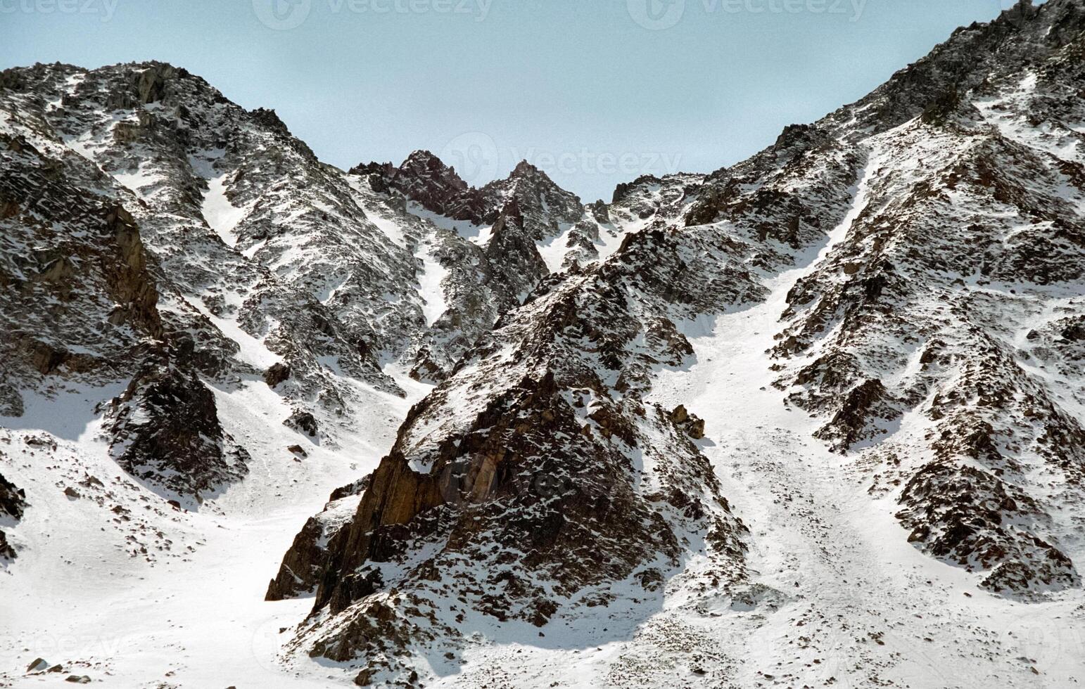 Mount Sayan in winter in snow. The nature of the mountains is sayan. photo